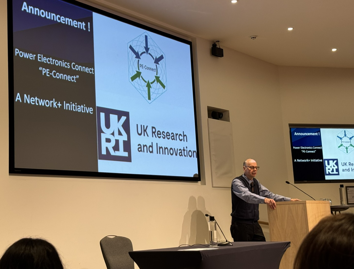 A person presenting at a conference